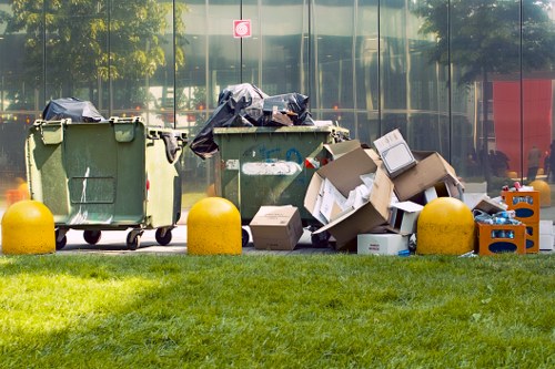 Workers managing construction waste with grab hire